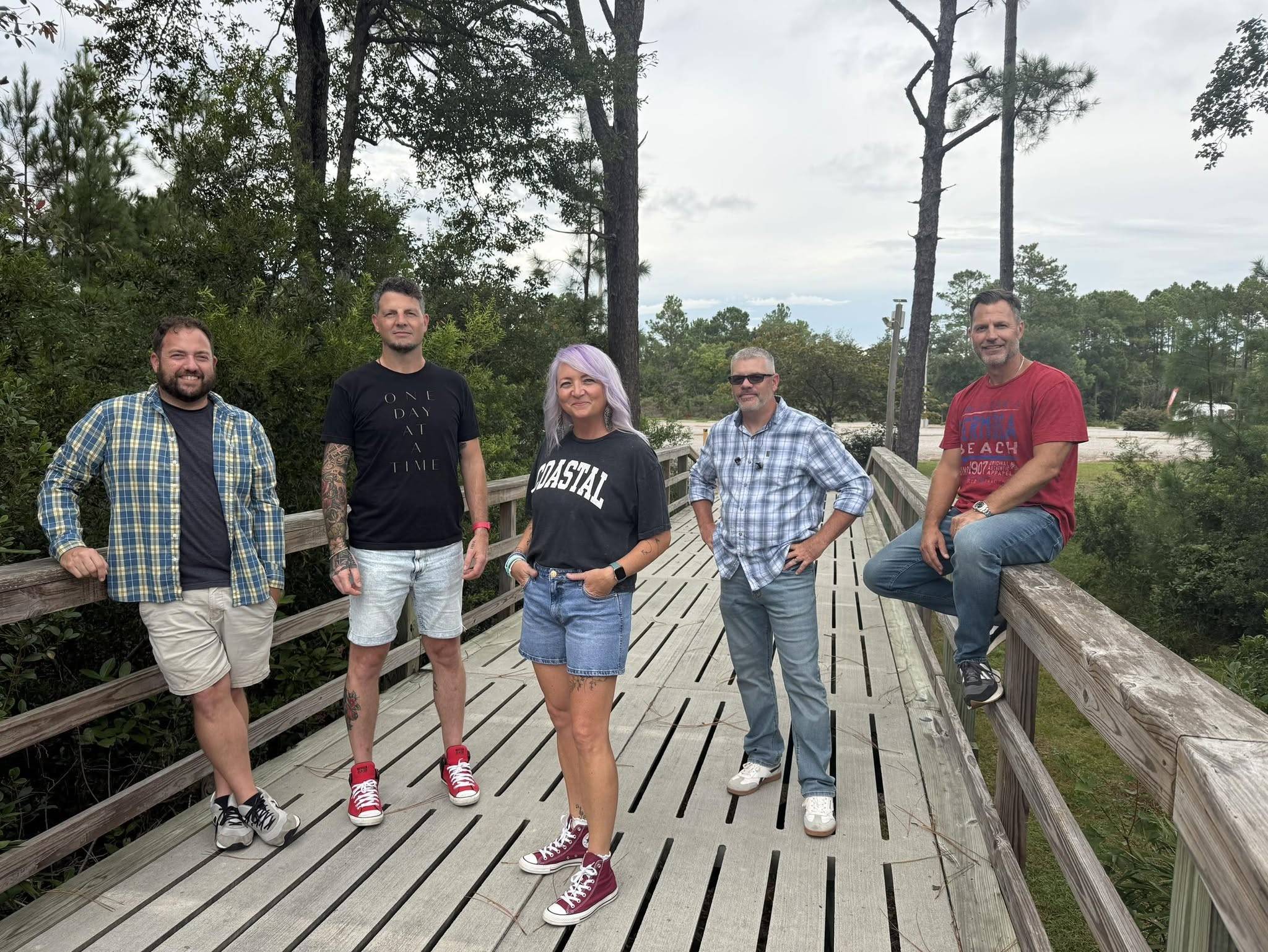 Break Free — five band members on a boardwalk in Southport, North Carolina